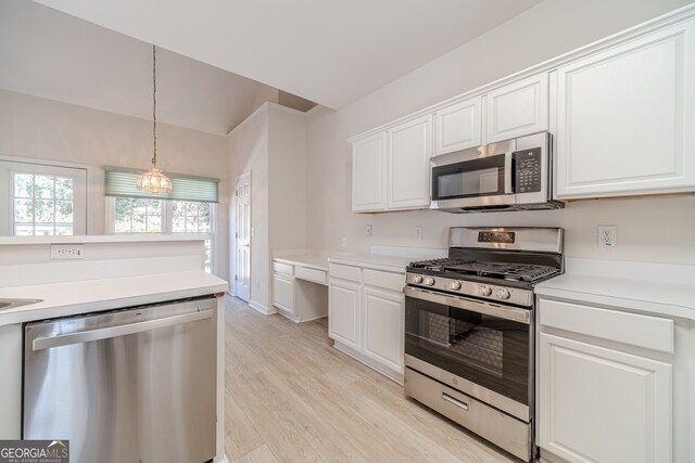 kitchen featuring white cabinetry, light wood-type flooring, and appliances with stainless steel finishes