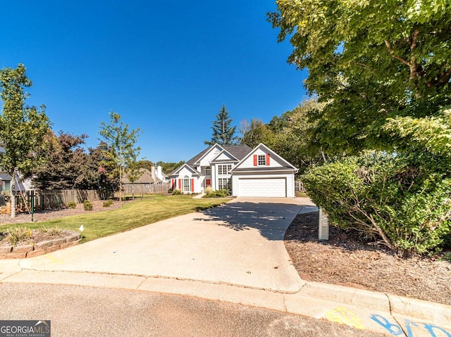 view of front of house featuring a garage and a front yard