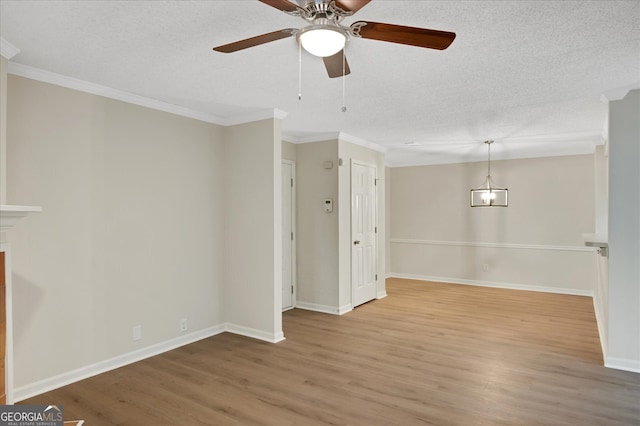 unfurnished room with crown molding, hardwood / wood-style floors, a textured ceiling, and ceiling fan