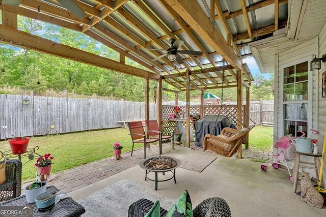 view of patio featuring ceiling fan, an outdoor fire pit, and a grill