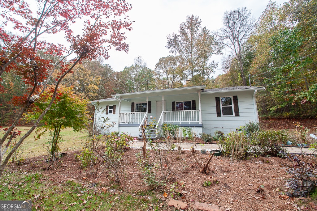 single story home with covered porch