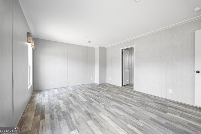 unfurnished room featuring light hardwood / wood-style floors