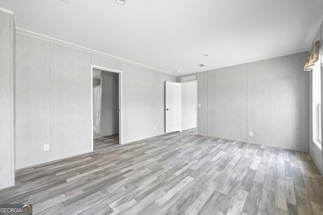 spare room featuring light wood-type flooring