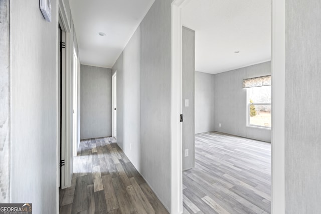 hall with hardwood / wood-style flooring