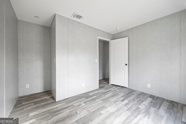 unfurnished bedroom with light wood-type flooring