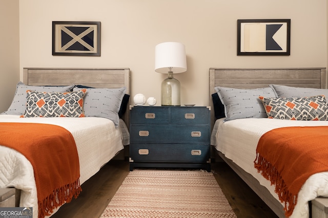 bedroom with wood-type flooring