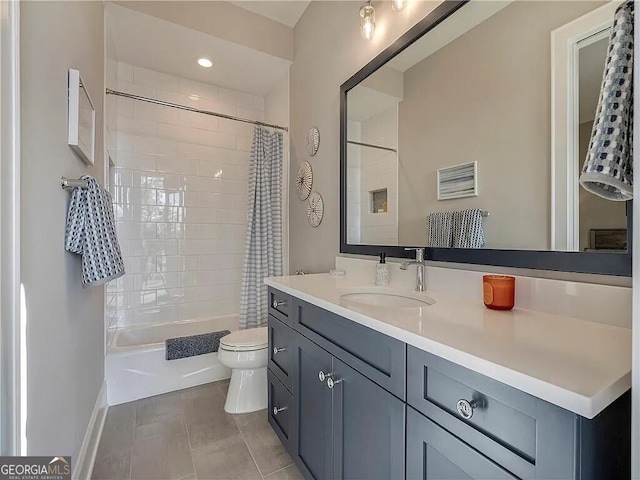 full bathroom with vanity, toilet, tile patterned floors, and shower / tub combo