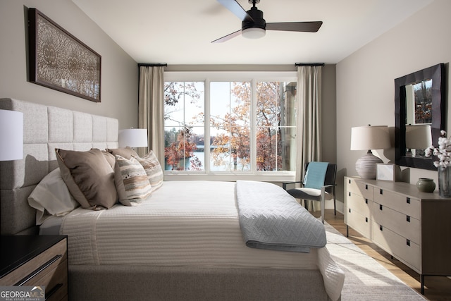 bedroom featuring light wood-type flooring and ceiling fan