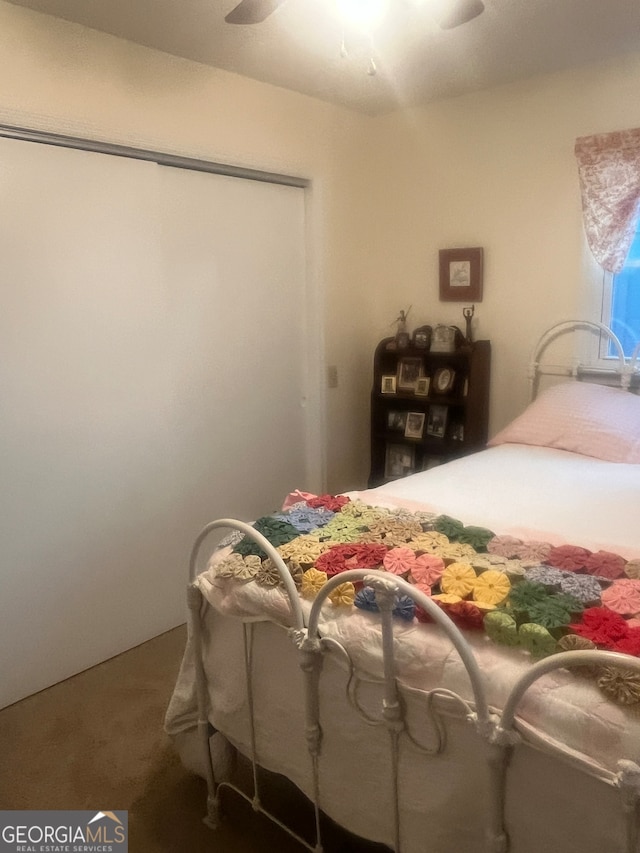 bedroom with a closet, carpet floors, and ceiling fan