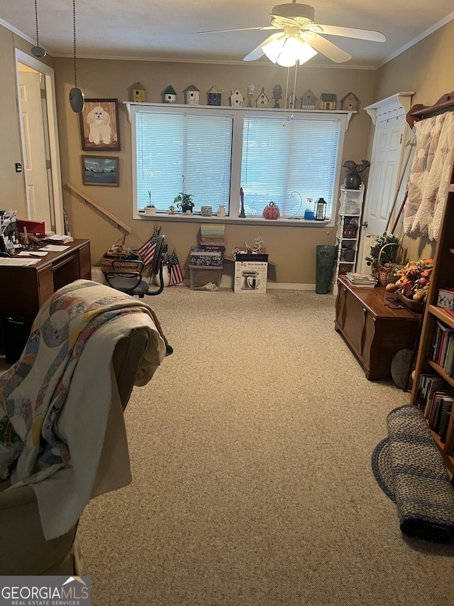 miscellaneous room featuring ornamental molding, a ceiling fan, and carpet floors
