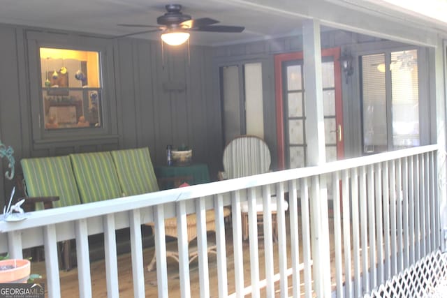 exterior space featuring hardwood / wood-style flooring and ceiling fan