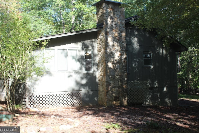 view of property exterior with a chimney