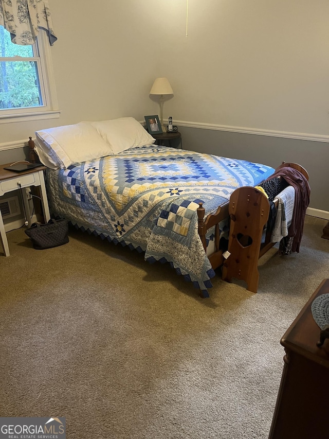 bedroom with baseboards and carpet floors