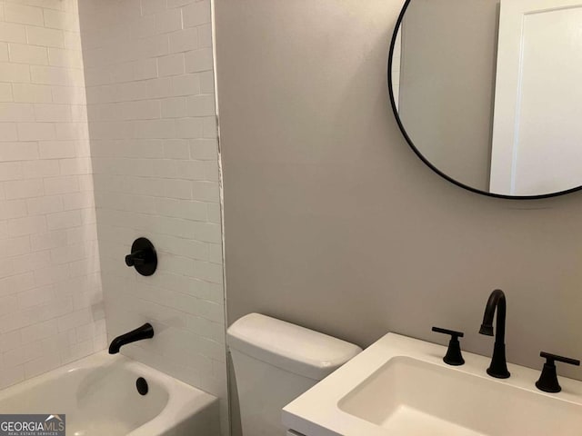 full bathroom featuring vanity, toilet, and tiled shower / bath combo