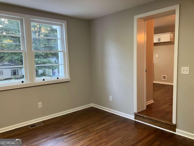 unfurnished bedroom featuring dark wood-type flooring