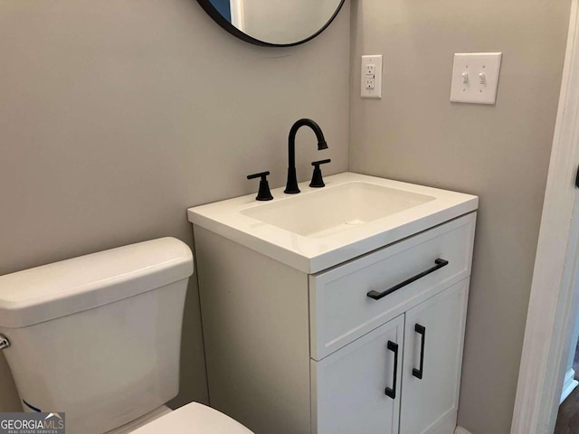 bathroom with vanity and toilet