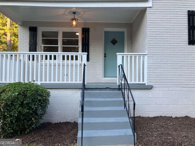 doorway to property with covered porch