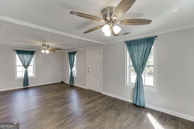 spare room featuring dark wood-type flooring, ceiling fan, and ornamental molding