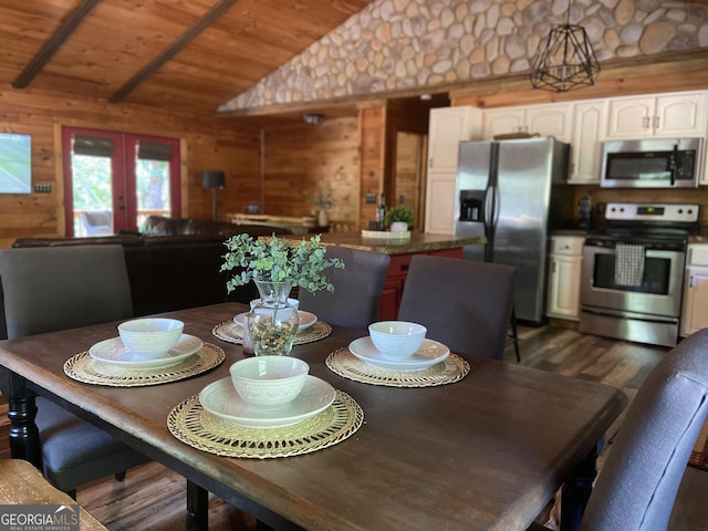 dining area with french doors, wood ceiling, wooden walls, dark hardwood / wood-style floors, and lofted ceiling