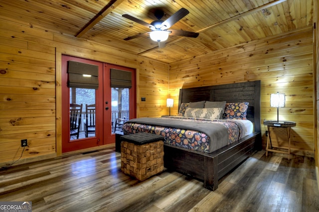 bedroom with wood walls, access to outside, french doors, ceiling fan, and dark hardwood / wood-style floors