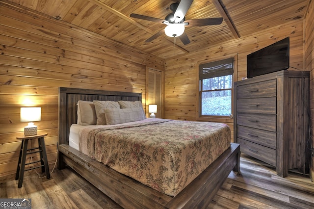 bedroom with dark hardwood / wood-style floors, ceiling fan, wooden walls, and wood ceiling