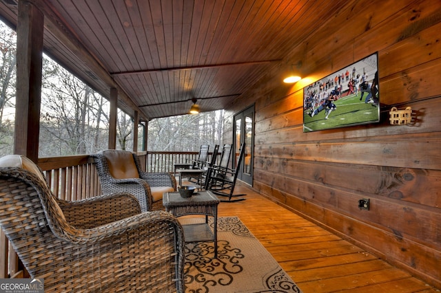 wooden terrace with a porch