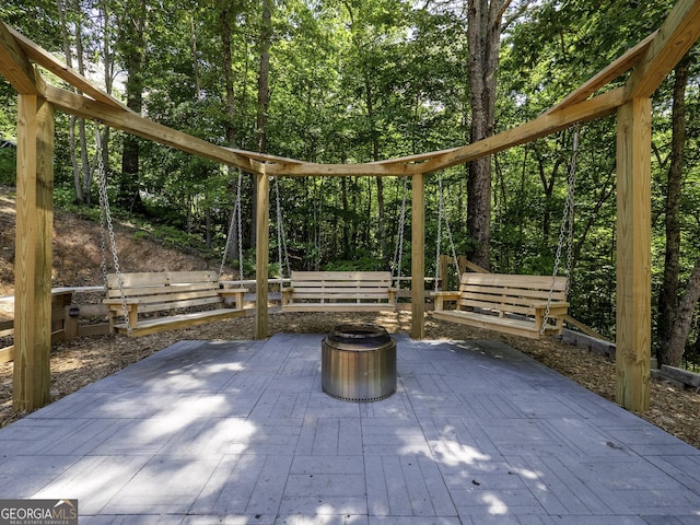 view of patio / terrace with area for grilling and an outdoor fire pit