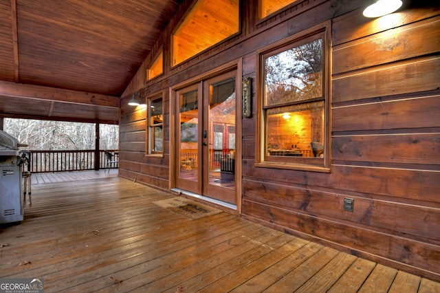 wooden deck with french doors and covered porch