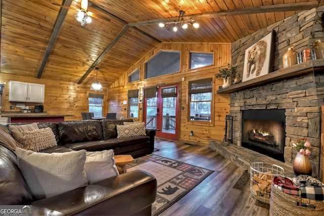 living room featuring wood walls, wooden ceiling, high vaulted ceiling, dark hardwood / wood-style floors, and a fireplace