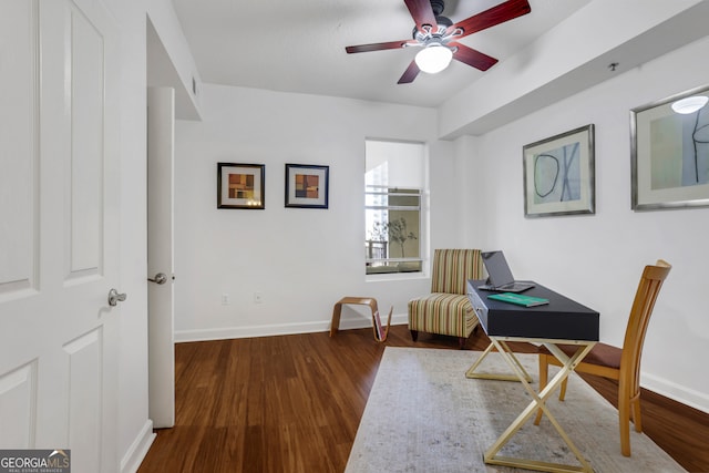 sitting room featuring ceiling fan and dark hardwood / wood-style floors