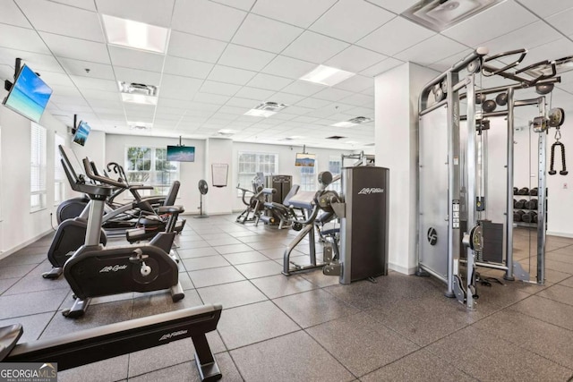 workout area with a drop ceiling