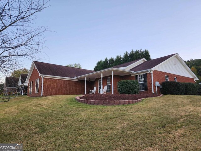 view of home's exterior with a yard