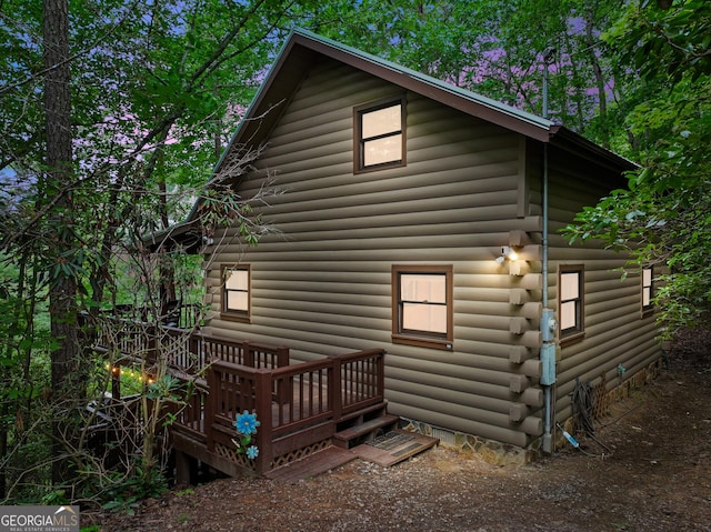 view of side of home featuring log exterior