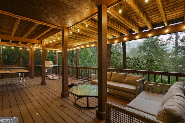 wooden terrace featuring an outdoor living space