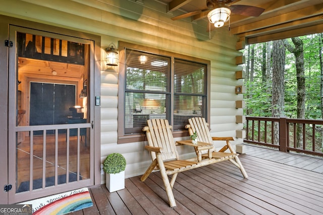 wooden deck featuring ceiling fan