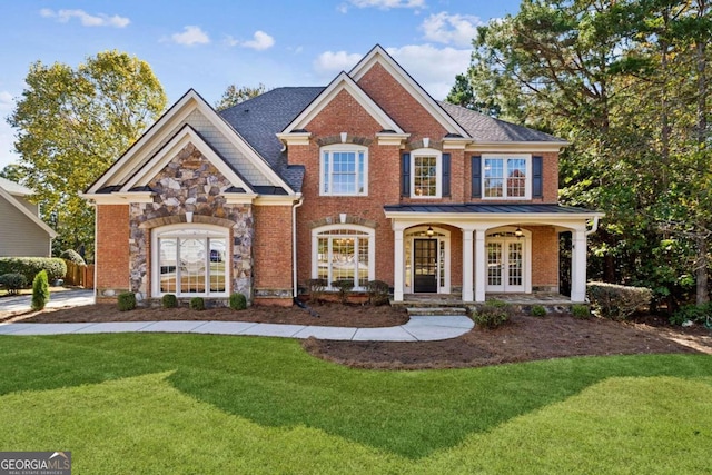 view of front facade featuring french doors, a front lawn, and a porch