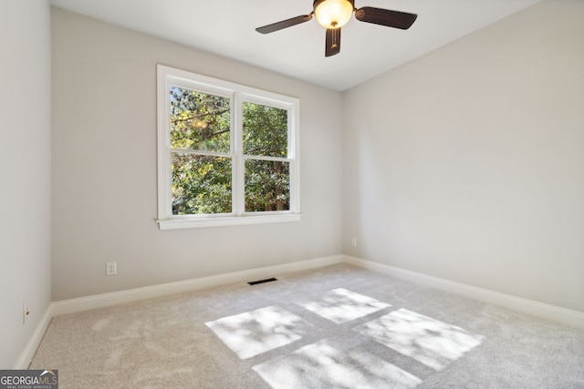 carpeted empty room with ceiling fan