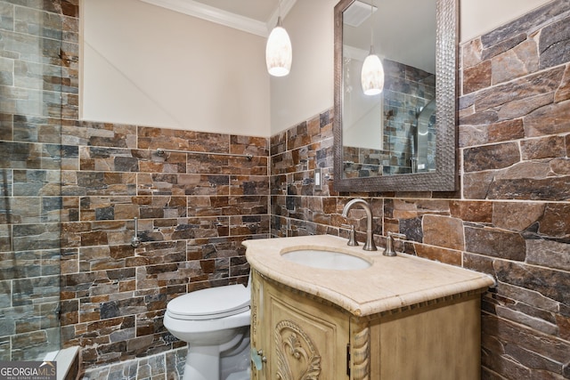 bathroom with vanity, ornamental molding, and toilet