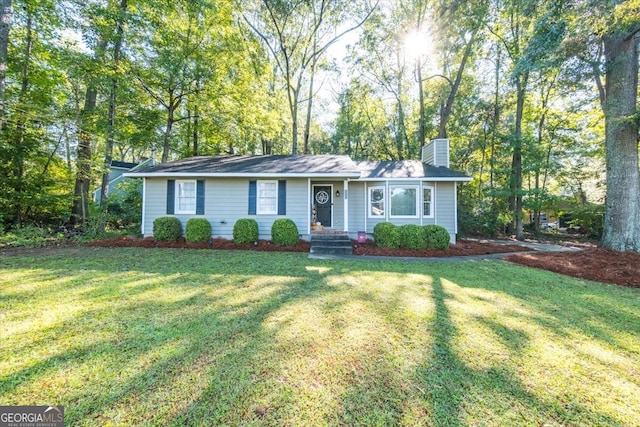 single story home featuring a front yard