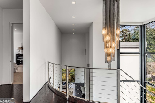 hall with hardwood / wood-style floors and recessed lighting