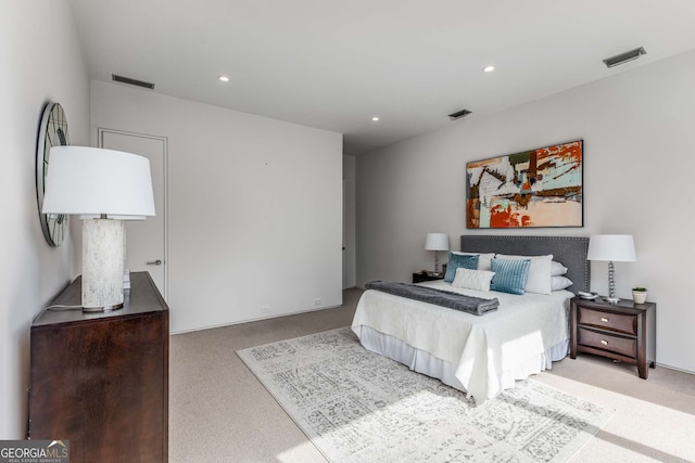 bedroom with carpet, visible vents, and recessed lighting