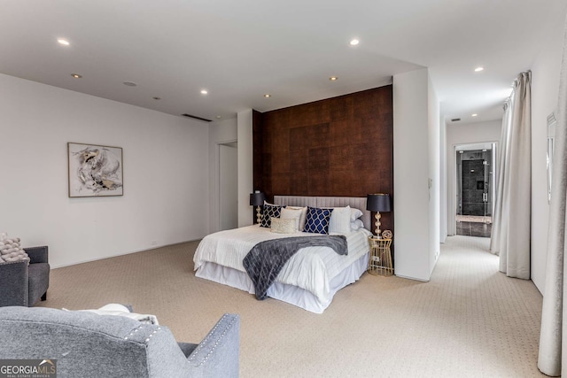 bedroom featuring light carpet and recessed lighting