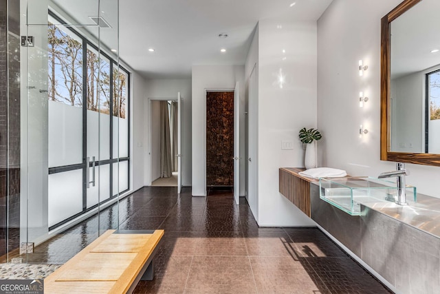 bathroom with a wealth of natural light and recessed lighting