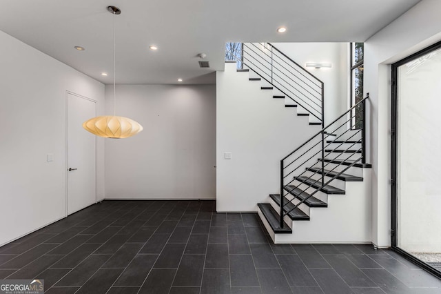 stairs featuring recessed lighting and visible vents