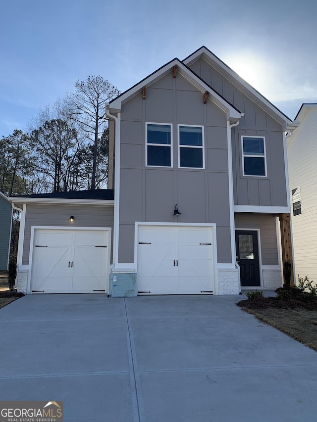 view of front of house with driveway and board and batten siding