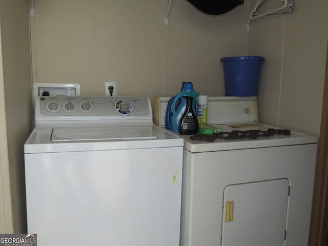 laundry area with independent washer and dryer