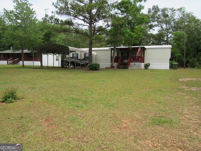 view of yard with a carport