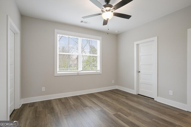 walk in closet featuring dark hardwood / wood-style flooring