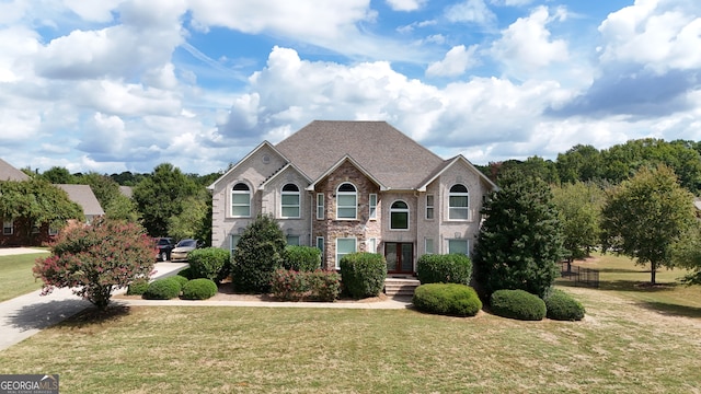 front facade featuring a front lawn