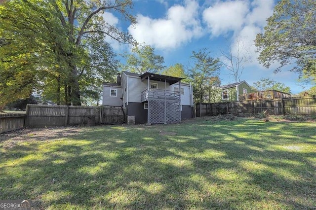 view of yard with a deck